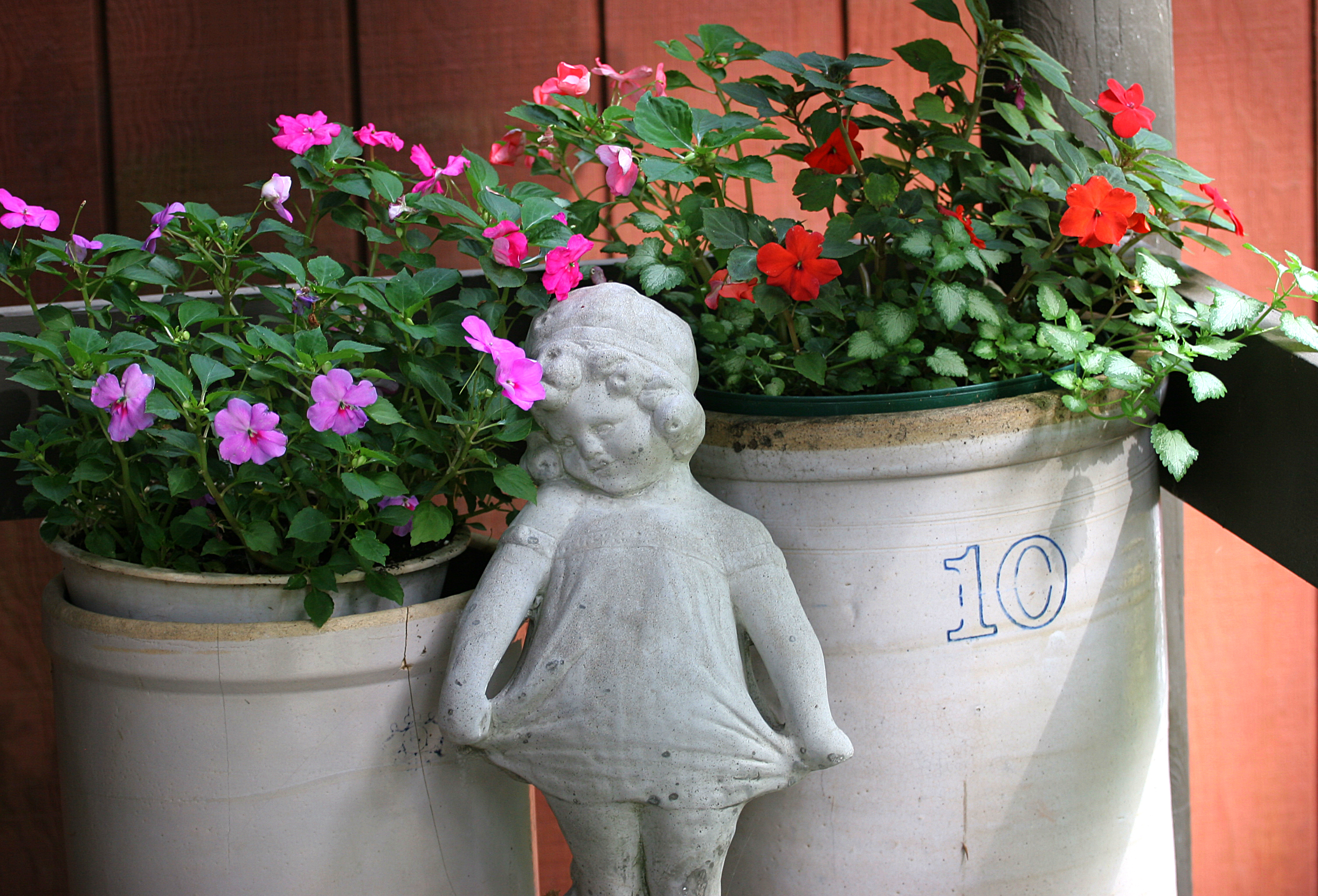 statue-of-child-in-front-of-flowers.jpg